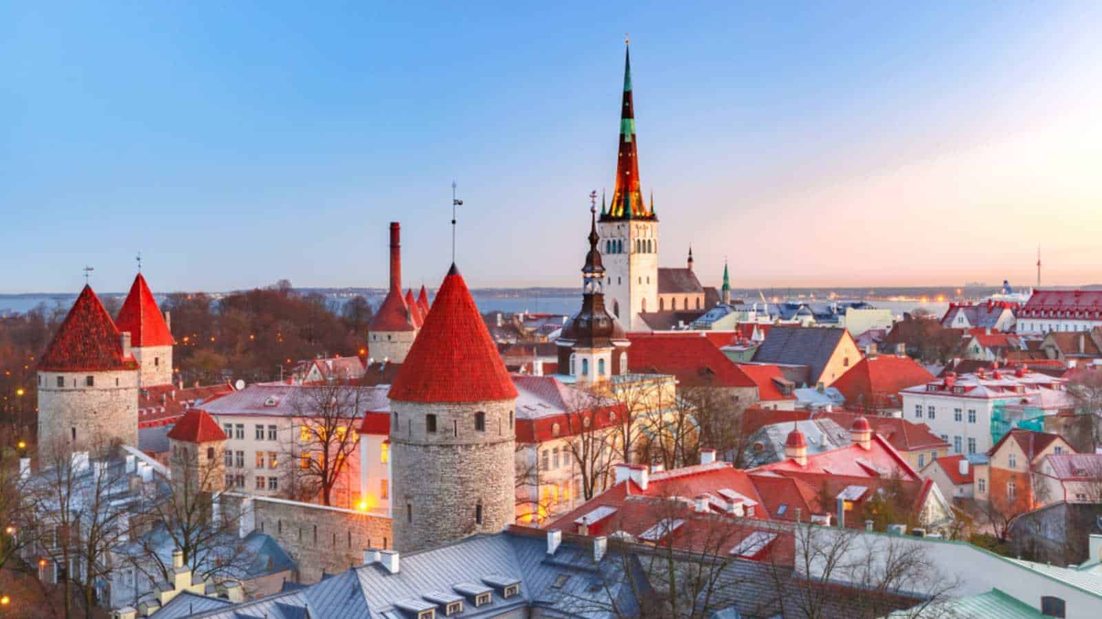 Aerial cityscape with Medieval Old Town, St. Olaf Baptist Church and Tallinn City Wall in the morning, Tallinn, Estonia