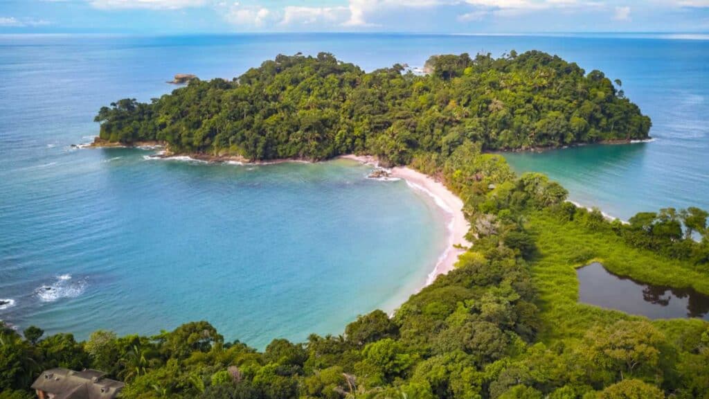 Drone shot of Manuel Antonio Beach near Quepos in Puntarenas. The best National Park in Costa Rica with the highest Biodiversity and lots of Animals, Wildlife, Tropical Plants and beautiful Beaches.