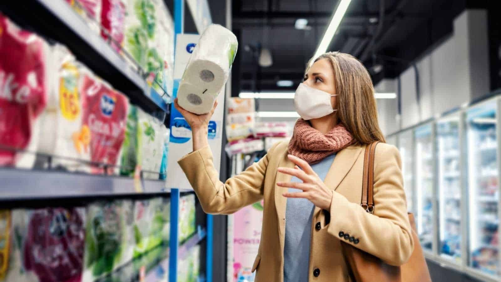 Woman buying toilet paper