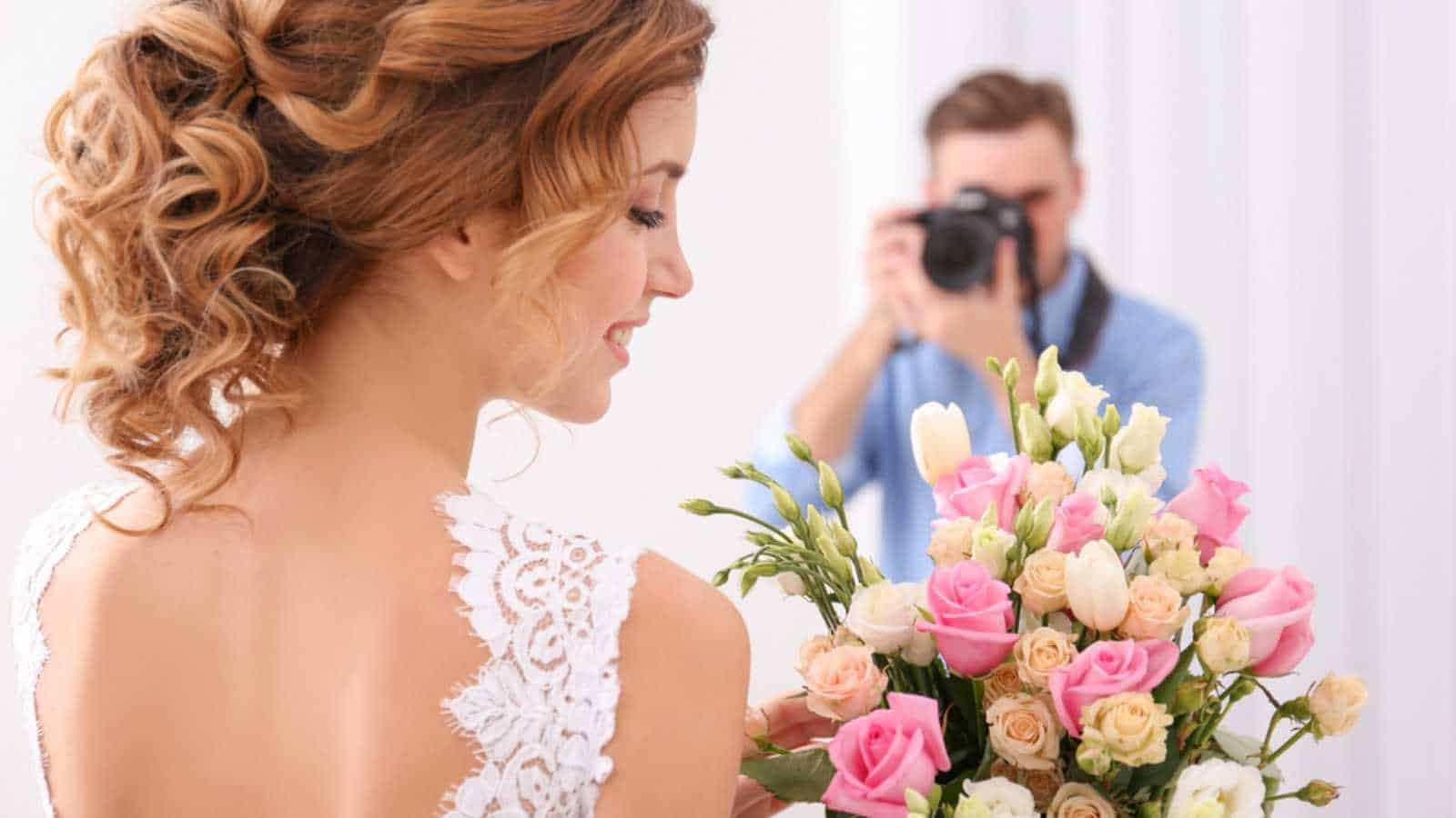 Man taking photo of bride
