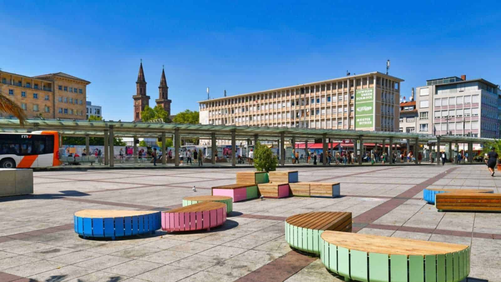 Ludwigshafen, Germany - August 2022: Town square called 'Berliner Platz' with public transportation bus and tram station