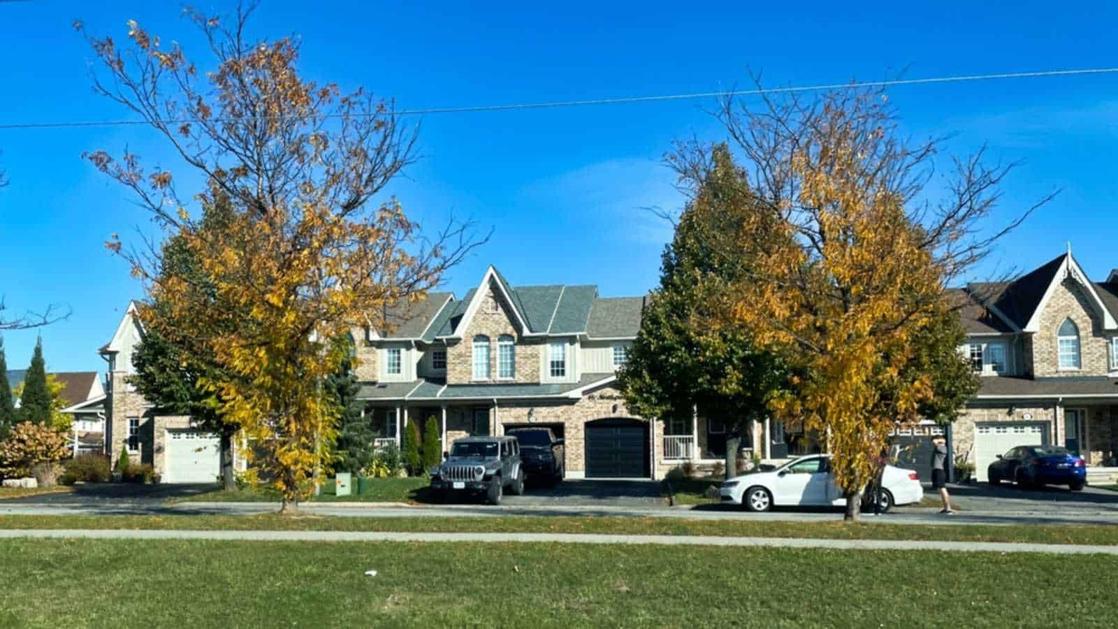 oshawa, canada - 23 October 2022: residential neighborhood with houses along road with trees around