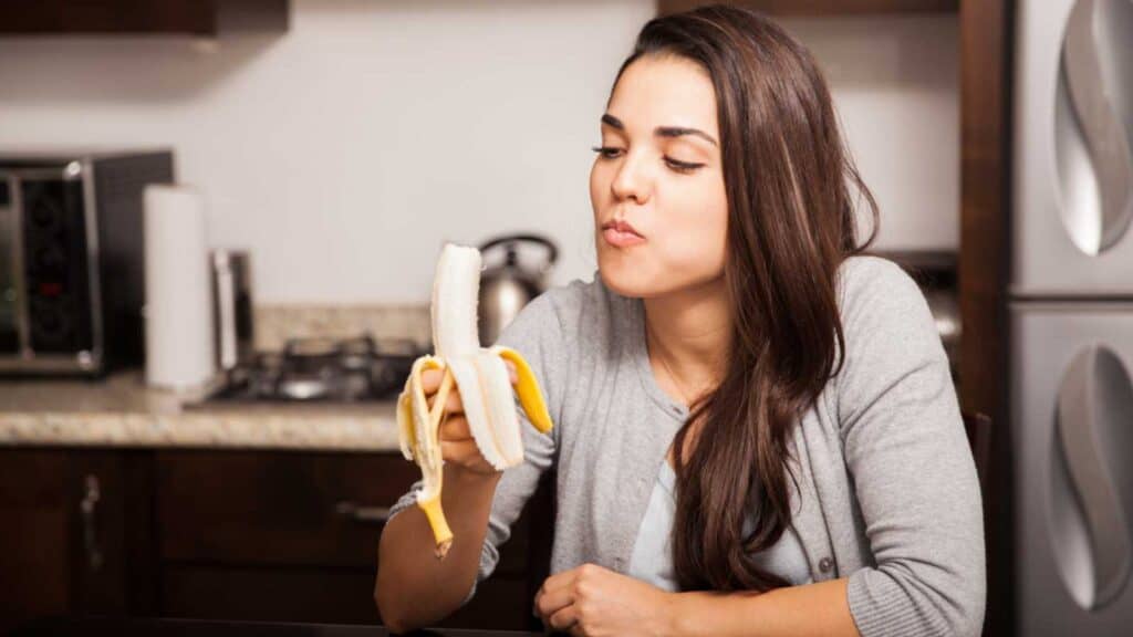 Woman eating banana