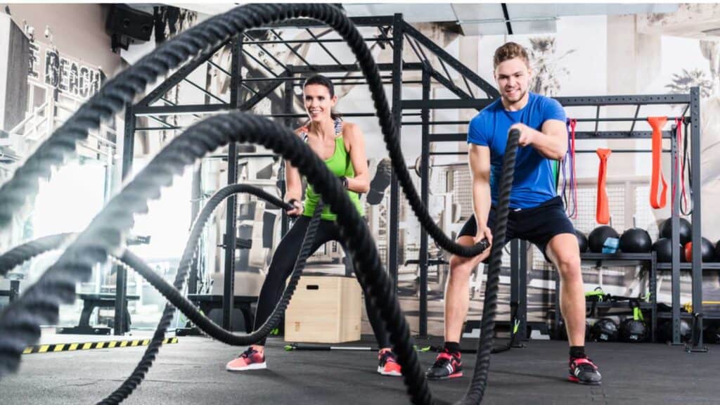 woman and man working out at gym