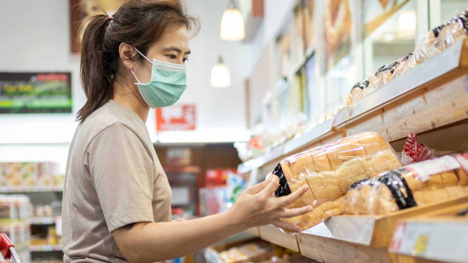 Woman purchasing bread