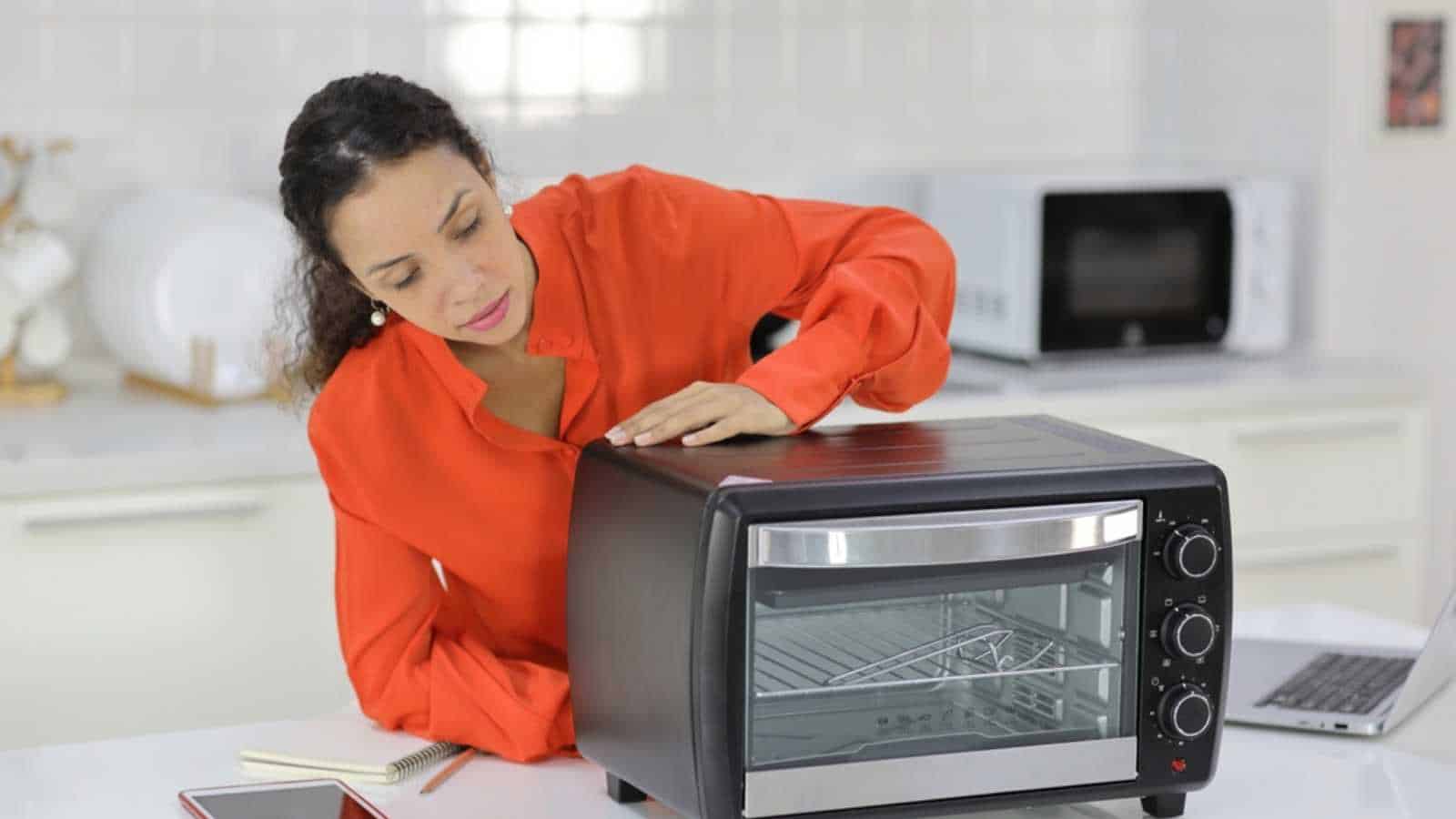 Woman repairing microwave
