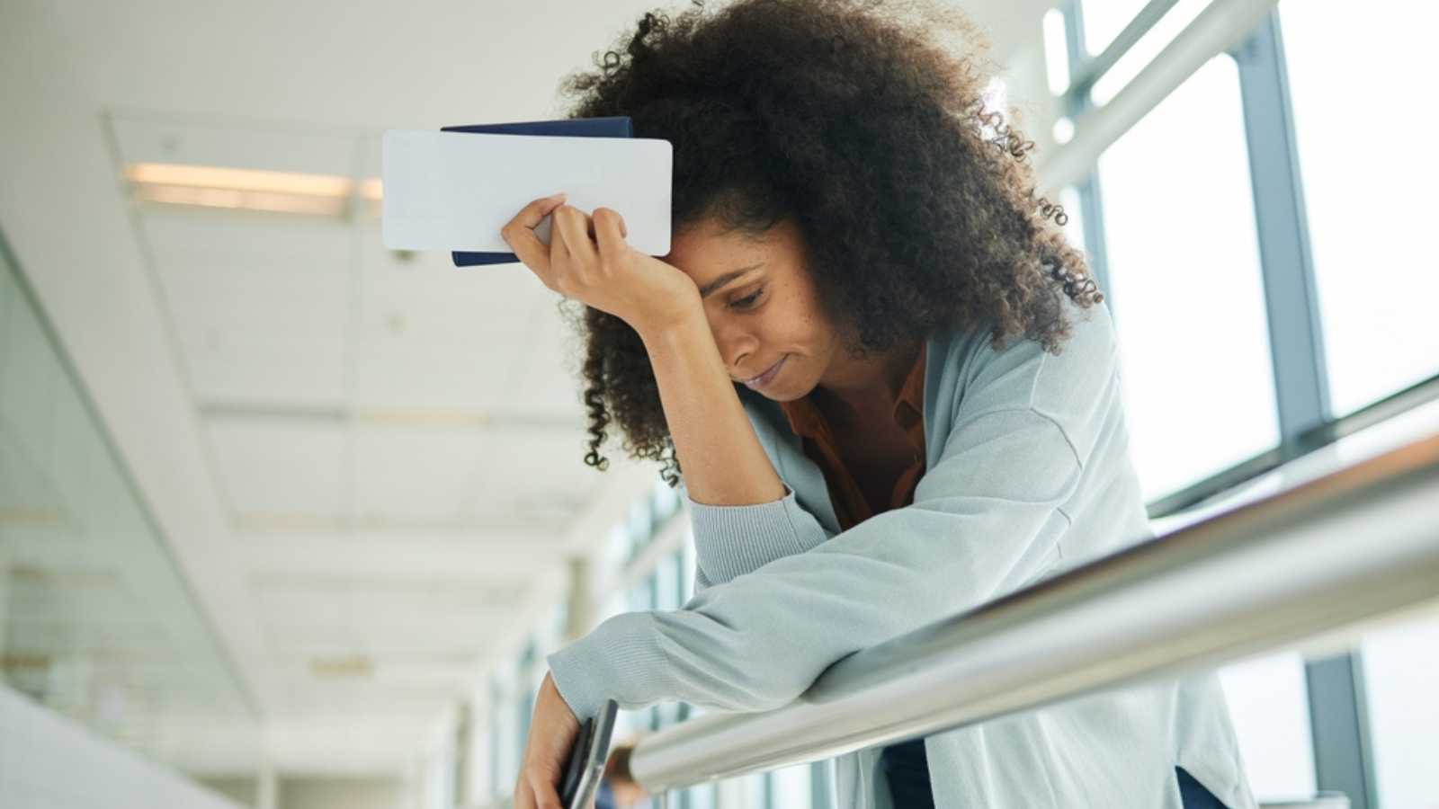 Woman stressed due to flight delay
