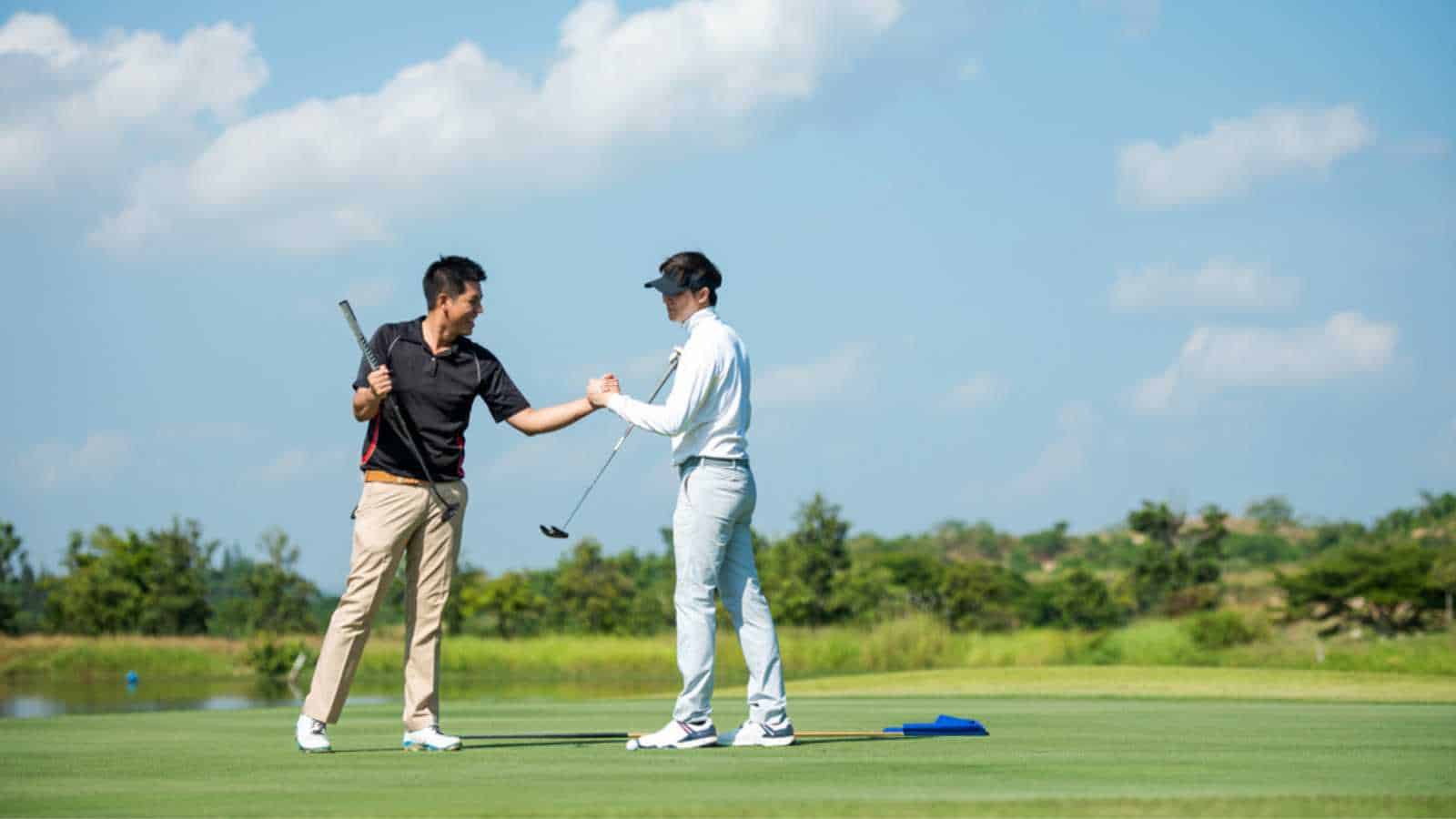 Club members playing golf