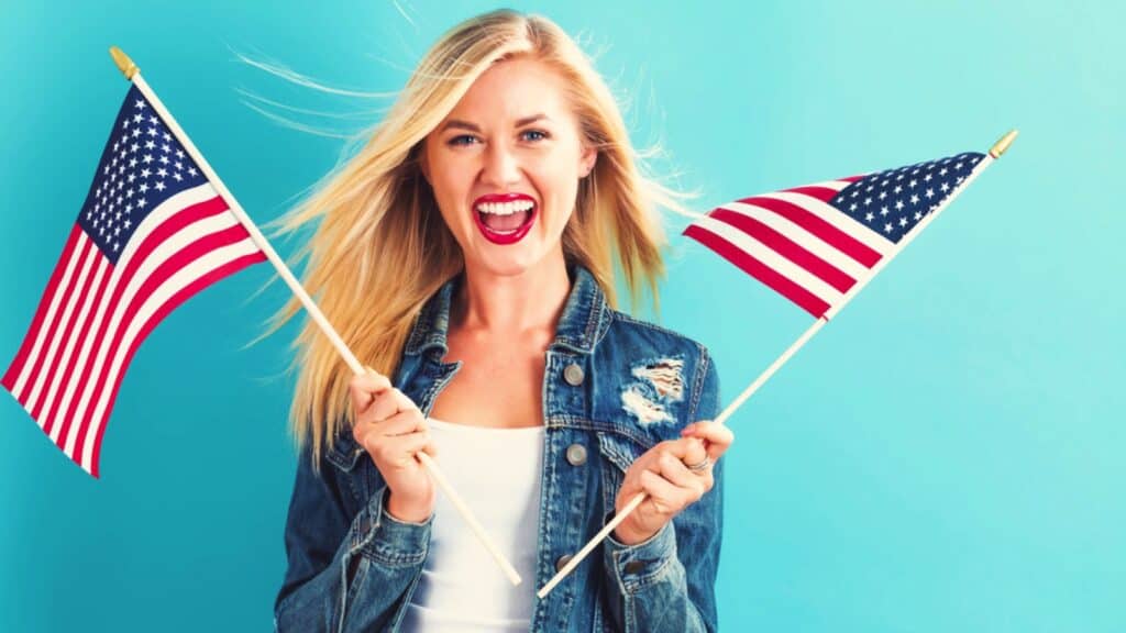 Happy American woman with American flag