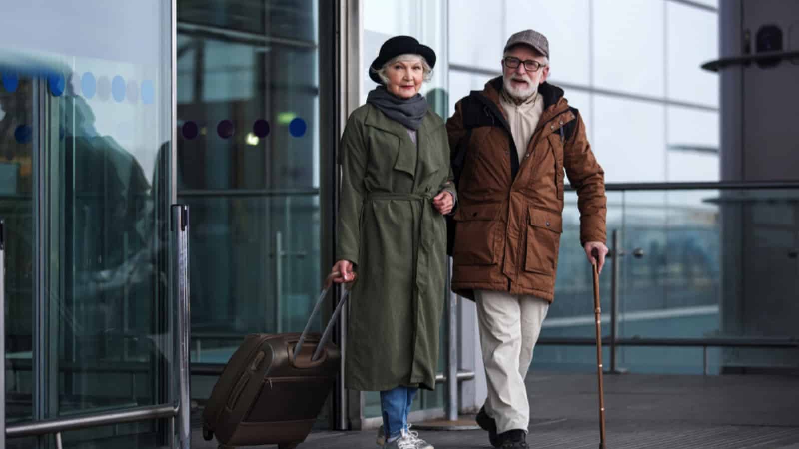 Old couples coming out of airport