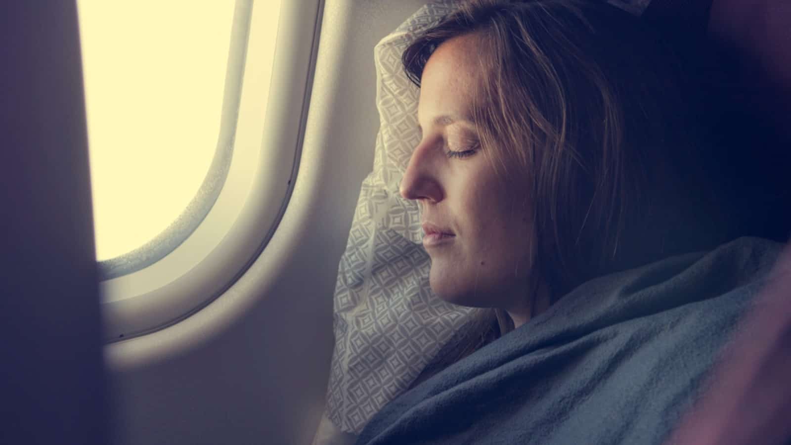 woman sleeping in flight