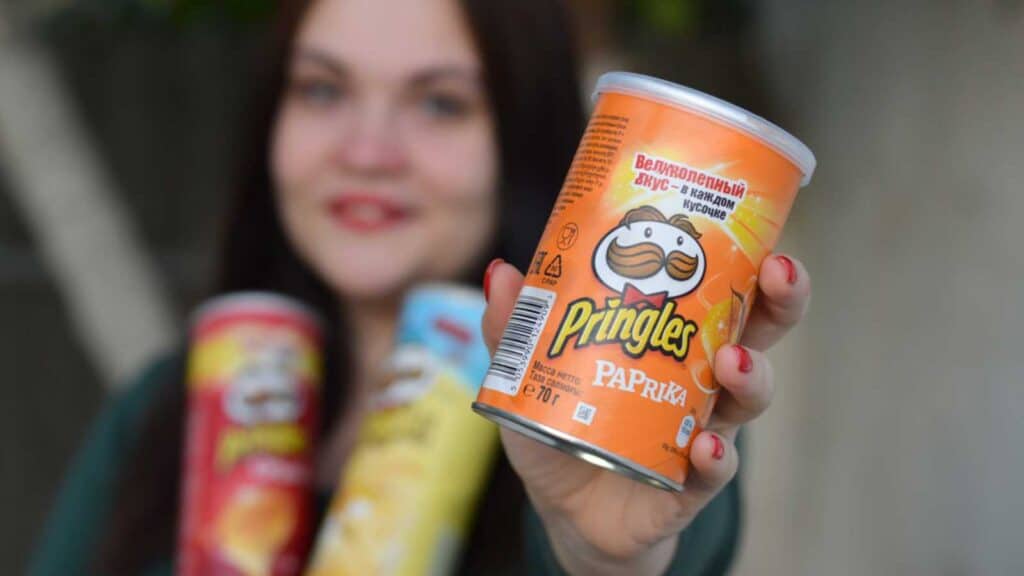Woman eating Pringles