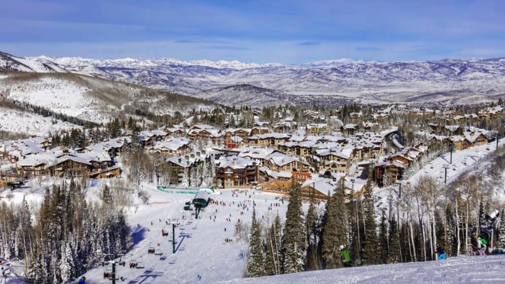A chair lift brings skiers to top of ski slopes of Deer Valley Ski Resort, near Park City and The Canyons. Host to the 2002 Winter Olympics, this mountain is a short drive from Salt Lake City.