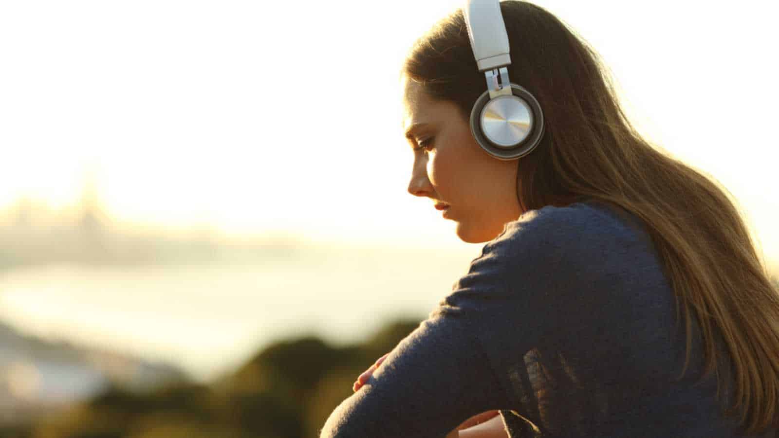 Introvert woman listening to music