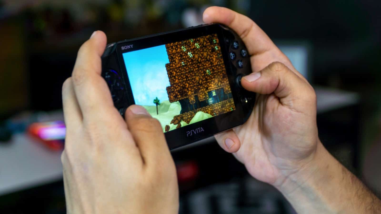 Istanbul, Turkey - November 2019: Guy playing Spelunky on Sony PS Vita - handheld playstation gaming console