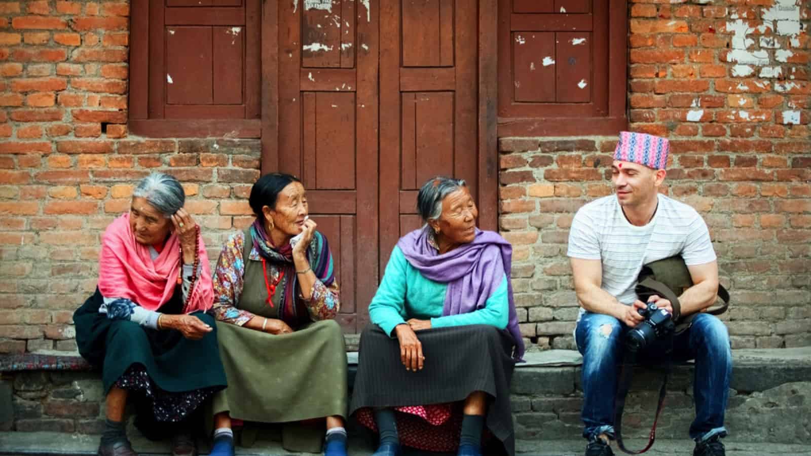 Traveler in Nepal with locals