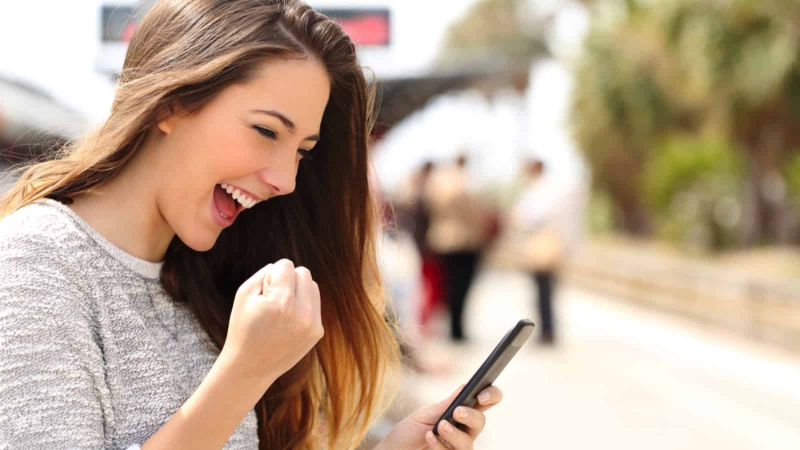 Woman excited with mobile