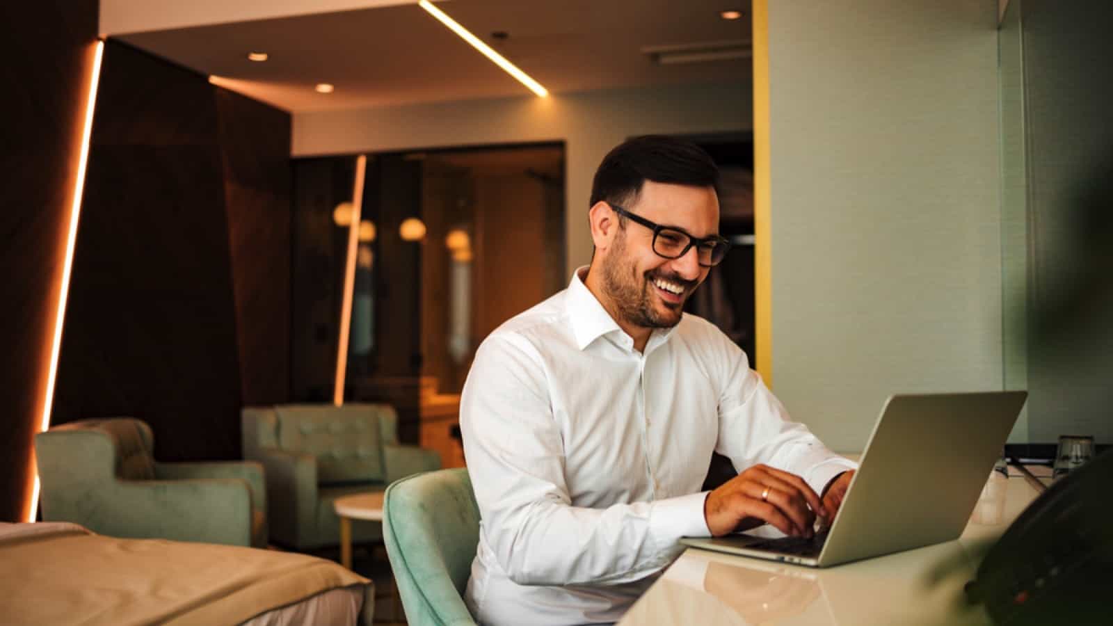 Businessman in hotel working in laptop