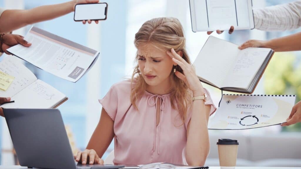 Businesswoman stress, anxiety and burnout in busy office