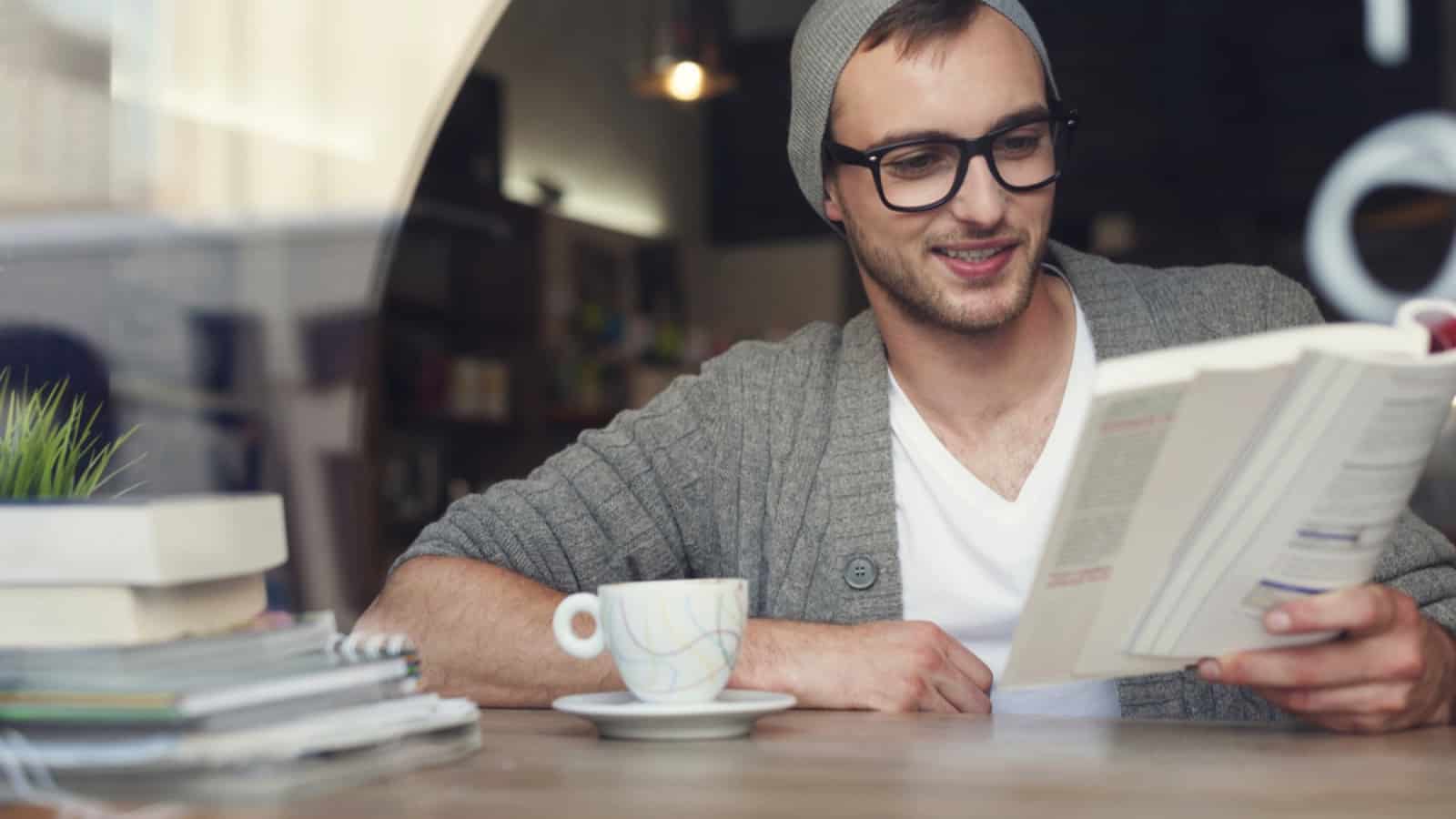 Hipster man reading book
