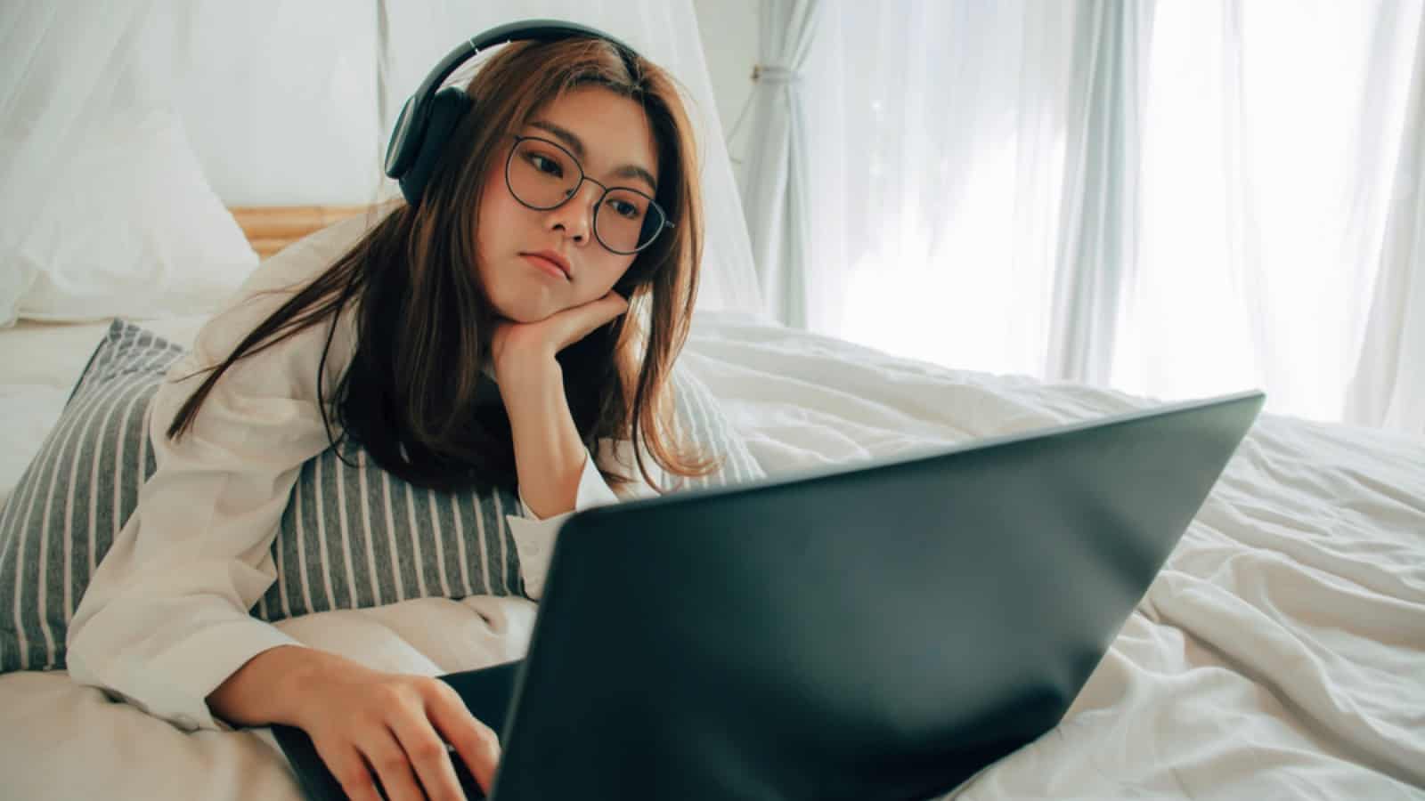 Woman with laptop listening to song