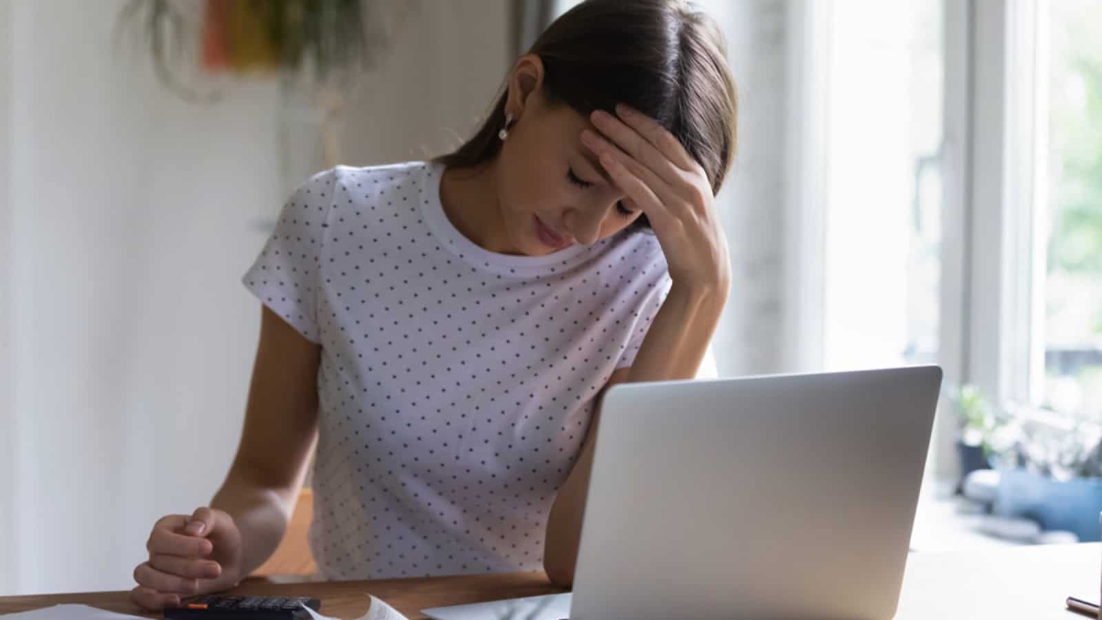 Woman working in laptop stressed