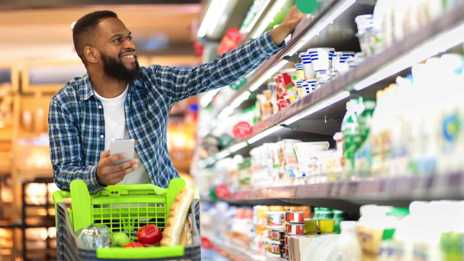 Man checking out an item at grocery store